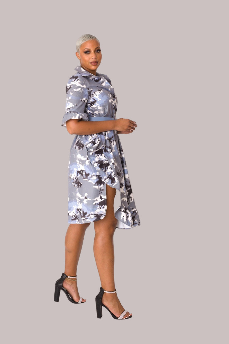 Model wearing camo print ruffle midi dress, angled front pose highlighting layered ruffle detail, feminine silhouette, and modern camo design by For Her NYC