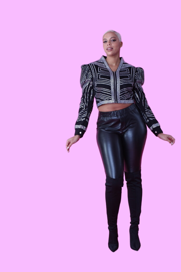 Black cropped jacket with rhinestone detailing shown in an alternate front full-length pose, highlighting the fitted silhouette, structured shoulders, and bold embellishment design by For Her NYC