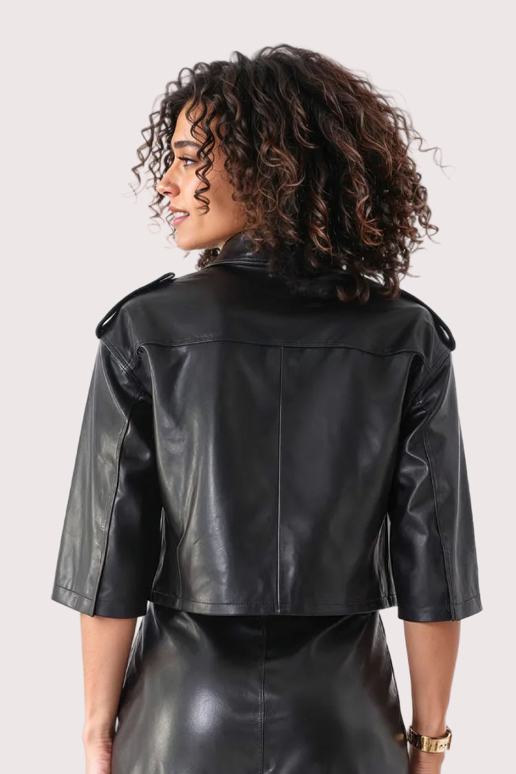 Back: Black cropped leather jacket with white bow accent, back view, For Her NYC.