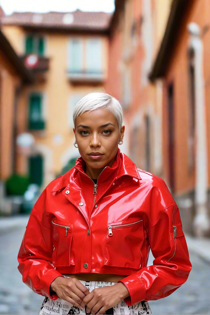 Angled front street pose showing details of cropped red vinyl jacket – For Her NYC
