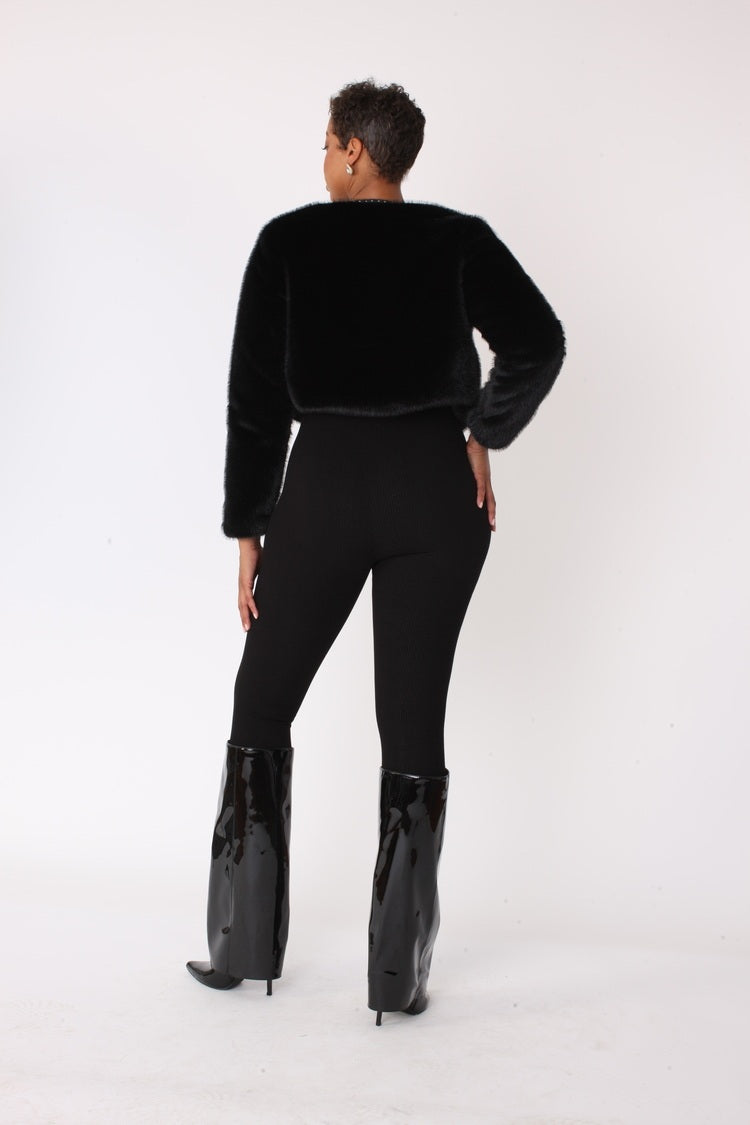 Back view of black cropped faux fur jacket with rhinestone trim – For Her NYC