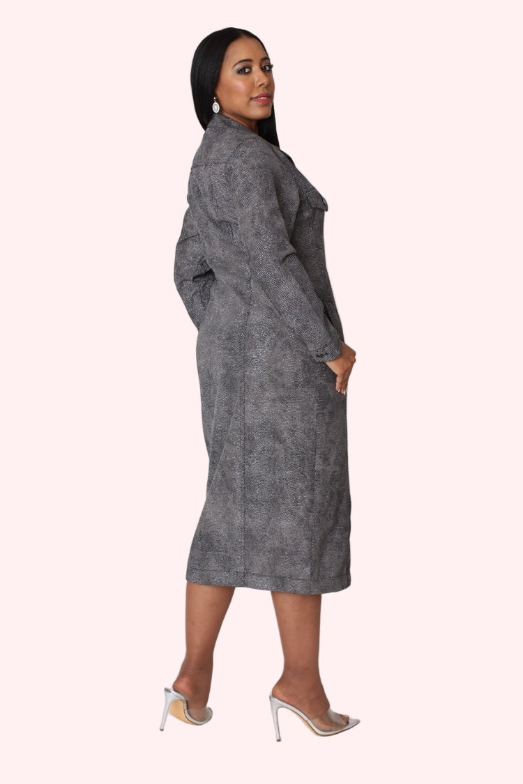 Three quarter angled view of model wearing the black denim crystal embellished midi dress emphasizing elegant shape and allover crystal shine by For Her NYC