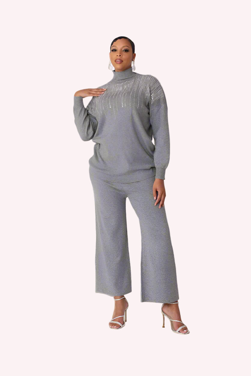 Model wearing the grey crystal rain lounge set standing front facing, highlighting soft knit fabric and embellished neckline detail by For Her NYC
