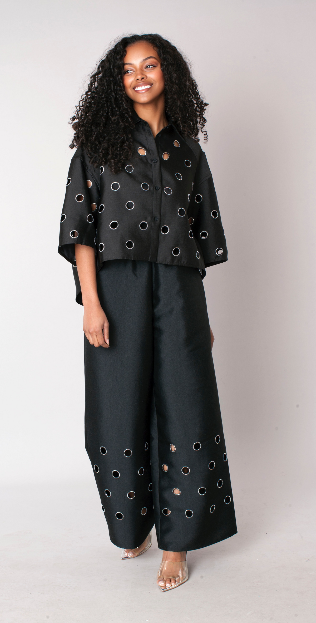 Black cutout grommet cropped button-down top with bold detailing and relaxed silhouette front view – For Her NYC