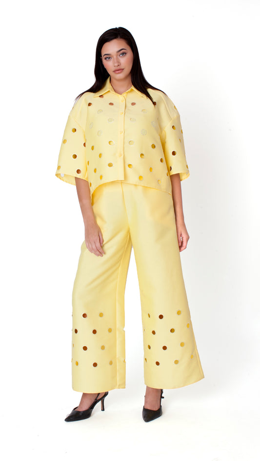 Yellow cutout grommet cropped button-down top with bold detailing and relaxed silhouette front view – For Her NYC