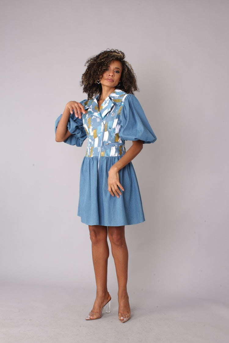 Denim blue puff sleeve dress shown from the front in a full-length standing pose, highlighting the abstract print bodice, puff sleeves, and flared skirt silhouette, casual chic dress by For Her NYC