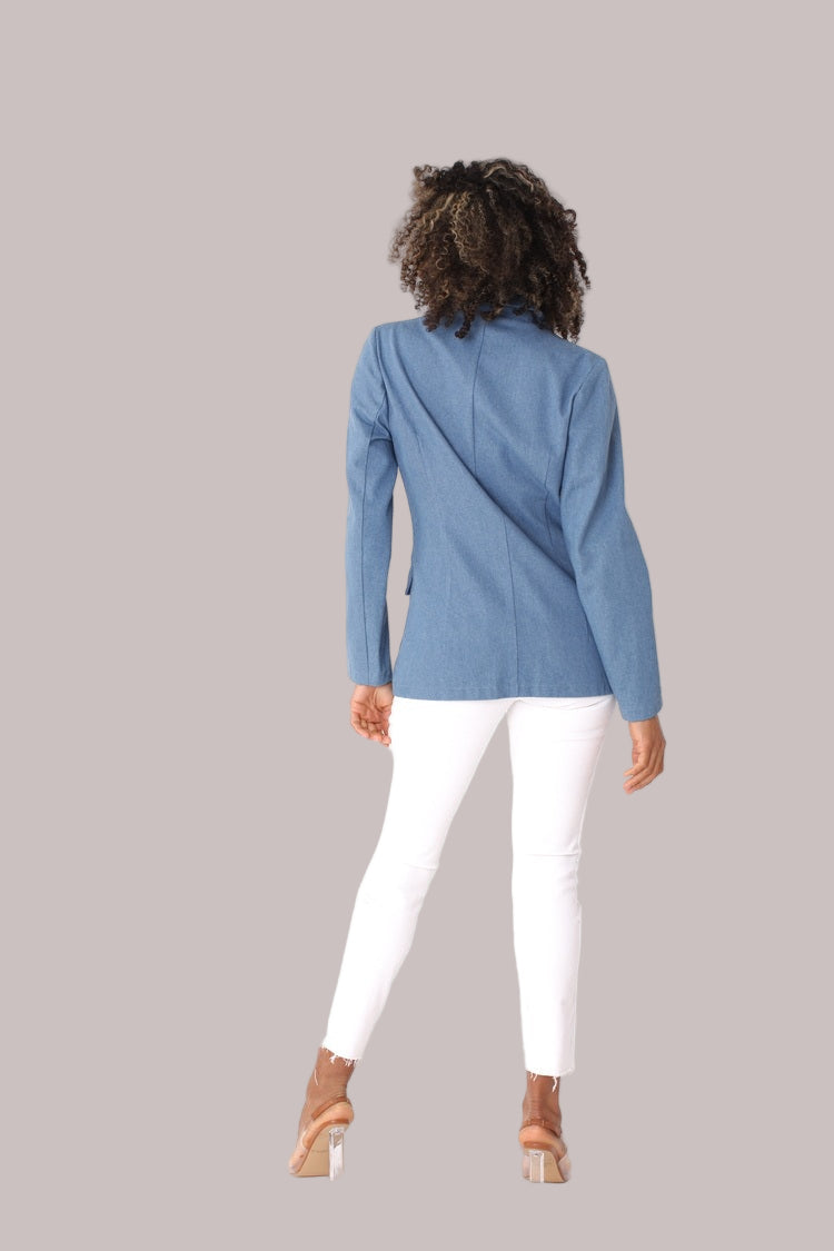 Denim blue double-breasted blazer shown from the back, emphasizing clean tailoring and versatile length by For Her NYC