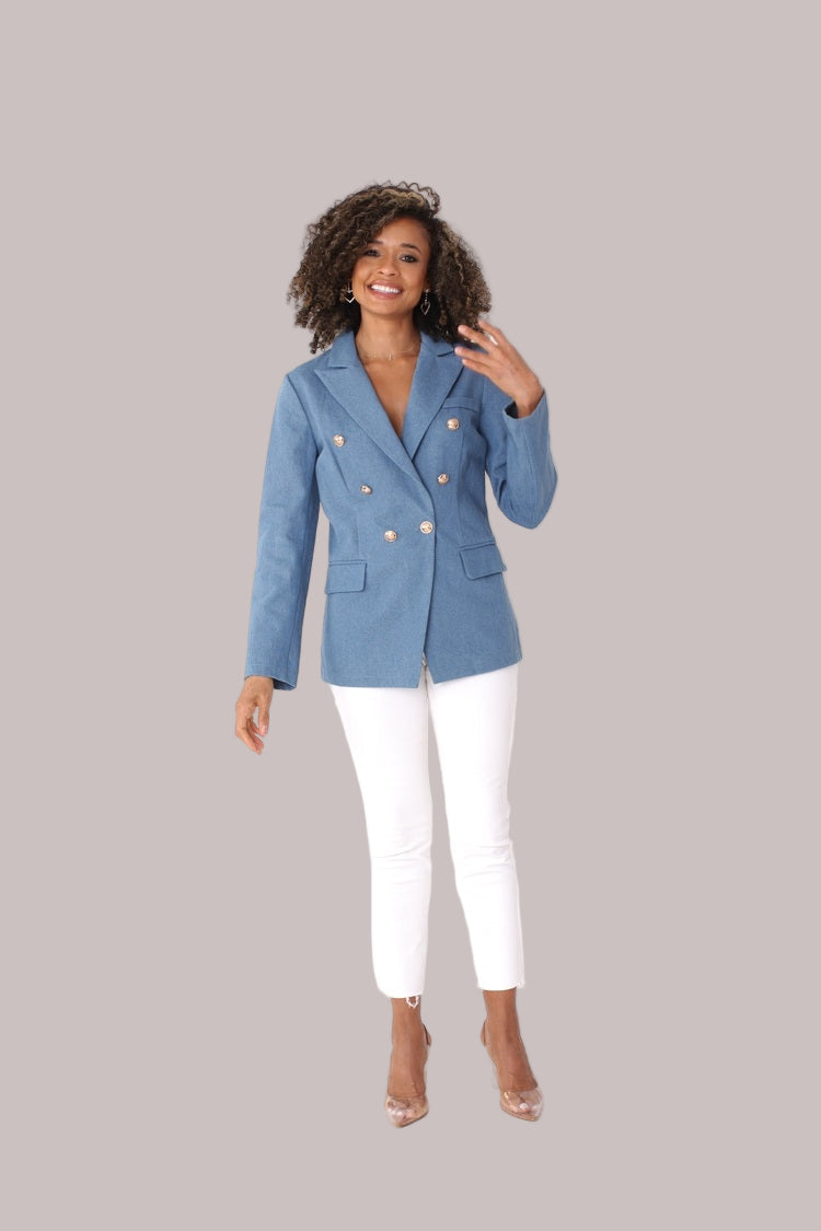 Denim blue double-breasted blazer shown from the front in a full-length pose, featuring gold-tone buttons and a structured fit by For Her NYC