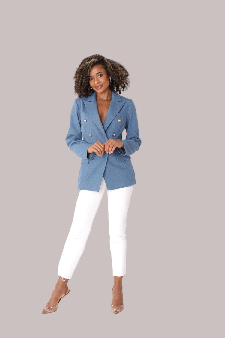 Denim blue double-breasted blazer shown from the front in a full-length pose, featuring gold-tone buttons and a structured fit by For Her NYC