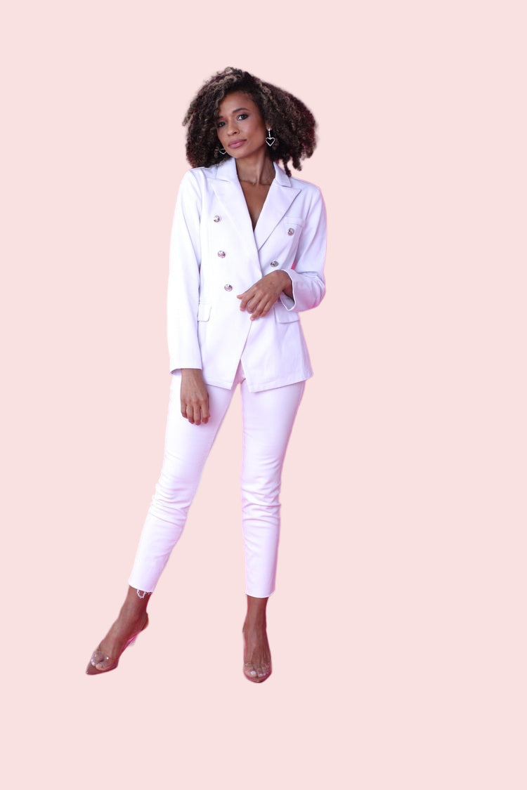 White double-breasted blazer shown from the front in a full-length standing pose, highlighting the structured silhouette and classic lapels by For Her NYC