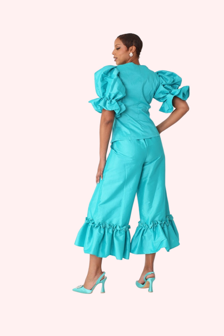 Model shown from the back wearing jade dramatic ruffle hem wide leg pants highlighting ruffle hem and tailored fit by For Her NYC