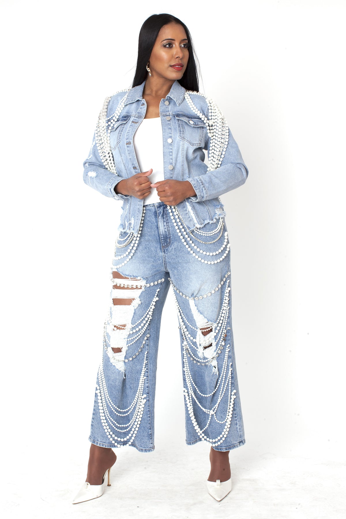 Light wash embellished wide leg denim pants featuring cascading pearl and crystal detailing, full body view by For Her NYC