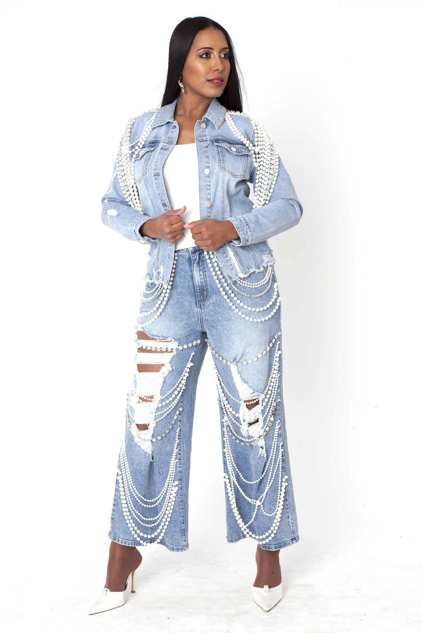 Light wash embellished wide leg denim pants featuring cascading pearl and crystal detailing, full body view by For Her NYC