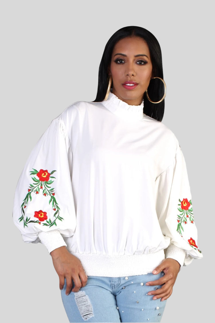 Front view of ivory balloon sleeve blouse with floral embroidered sleeves and elastic hem — For Her NYC.