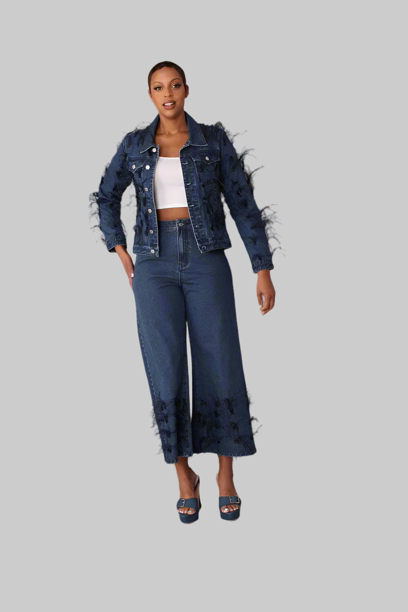 Blue denim jacket with black feather trim shown front standing pose styled with matching denim pants, For Her NYC