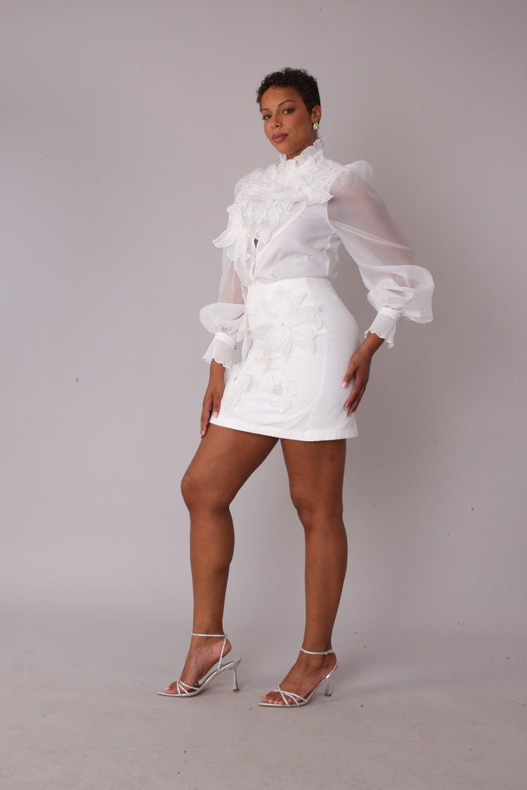 Model wearing Floral Embroidered White Cocktail Skirt in side profile pose showing skirt length, structure, and clean side fit, For Her NYC