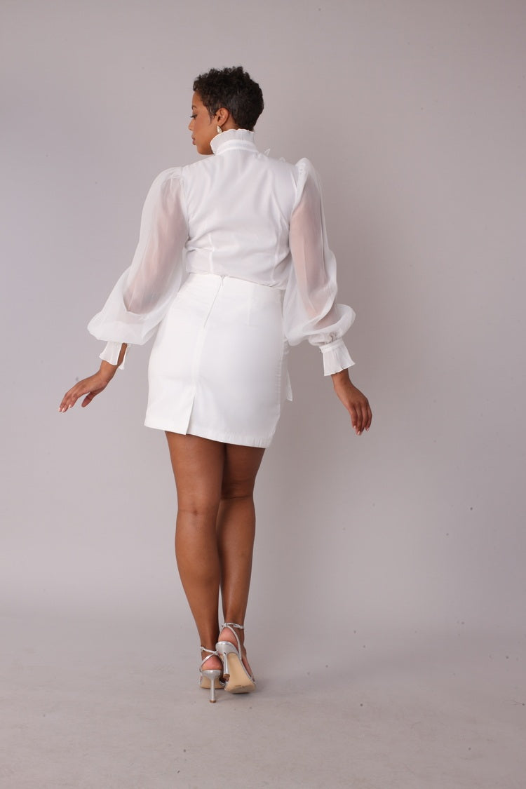 Model wearing Floral Embroidered White Cocktail Skirt in walking forward pose highlighting movement, texture, and embroidered detailing, For Her NYC