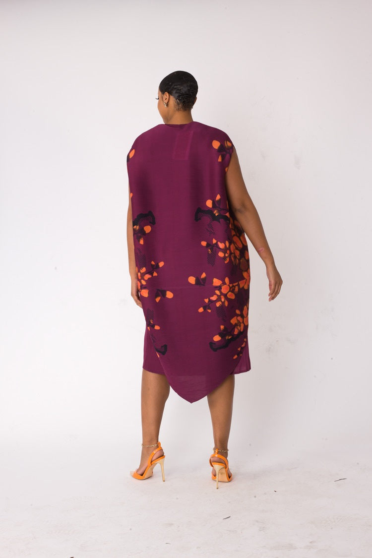 Back view of model wearing the red and purple floral overlay shift dress showing clean solid plum back and streamlined silhouette by For Her NYC