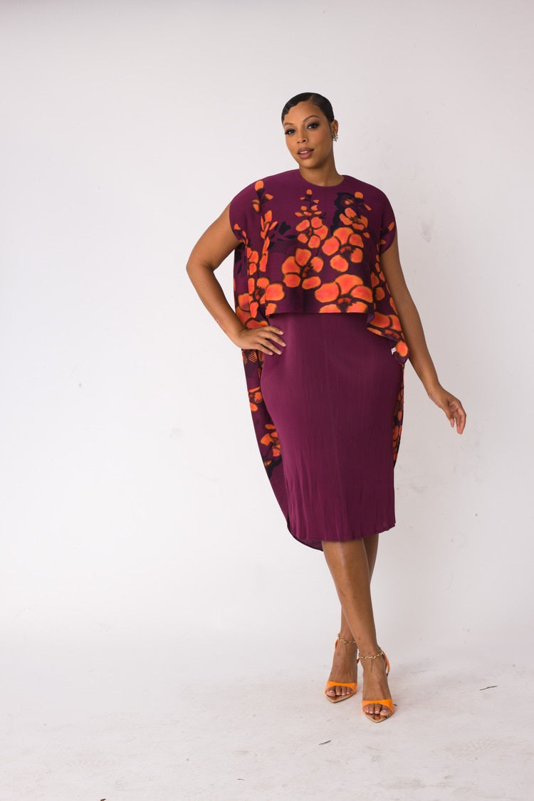 Front view of model wearing the red and purple floral overlay shift dress highlighting coral floral print overlay and sleek knee length fit by For Her NYC
