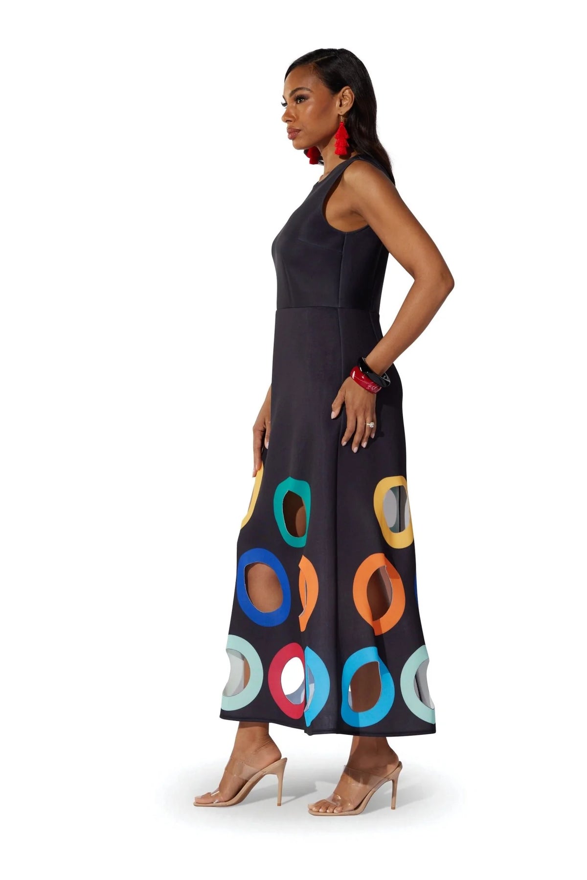 Model wearing the For Her NYC Colorful Circles Cutout Dress in black with multicolor circle cutout details along the skirt, style S0176.