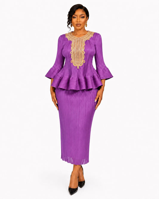 Front view of a model wearing the purple For Her NYC Embellished Peplum Pleated Skirt Set - 83470 with gold neckline detailing, three-quarter flared sleeves, a ruffled peplum top, and pleated midi skirt