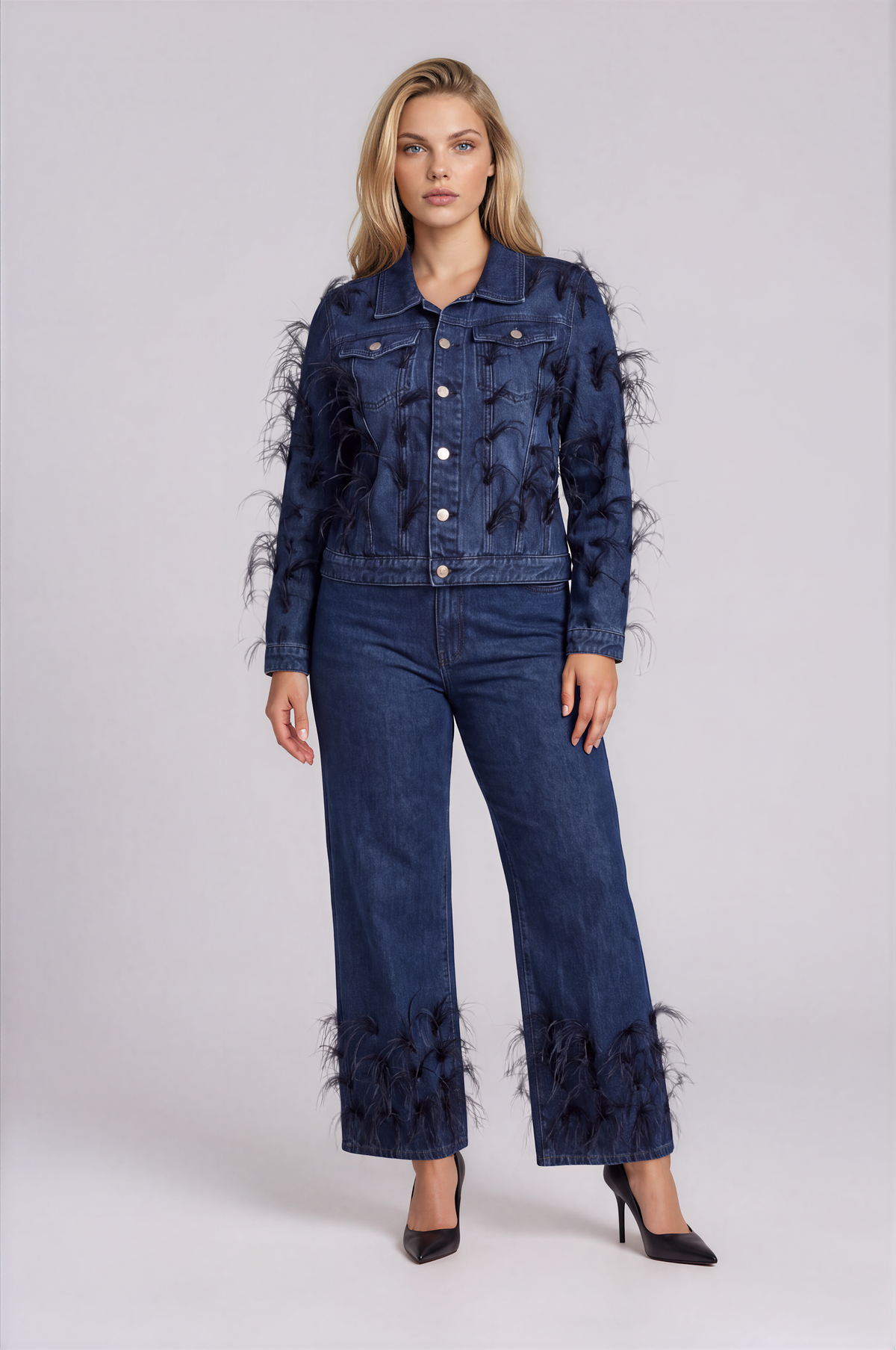 Front view of a model wearing the dark-wash For Her NYC Feather Trim Wide Leg Jeans - 82304 with wide legs and feather embellishments near the hems