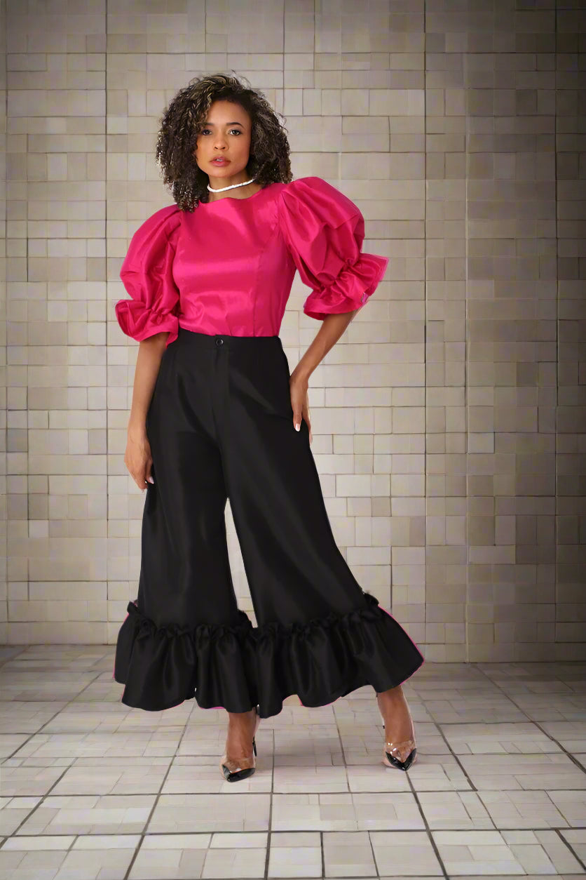 Fuchsia puff sleeve satin blouse shown in full front pose styled with black skirt — For Her NYC