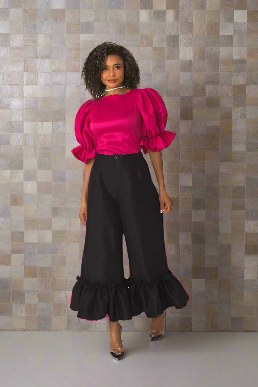 Fuchsia puff sleeve satin blouse in walking pose showing sleeve volume and satin sheen — For Her NYC
