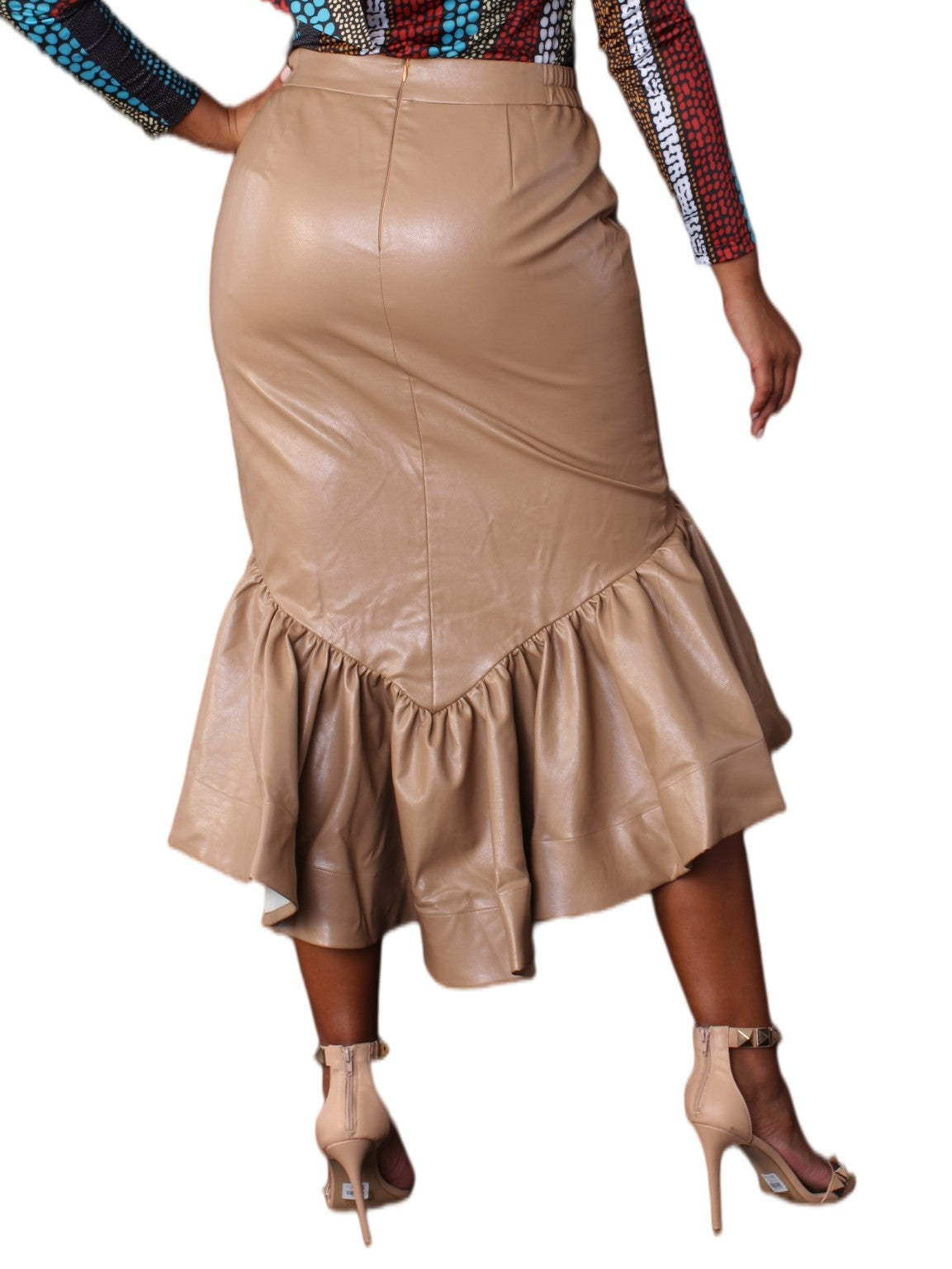 Back view of a model wearing the For Her NYC Leather Ruffle Midi Skirt - 81916, highlighting the back zipper and asymmetrical ruffle hem