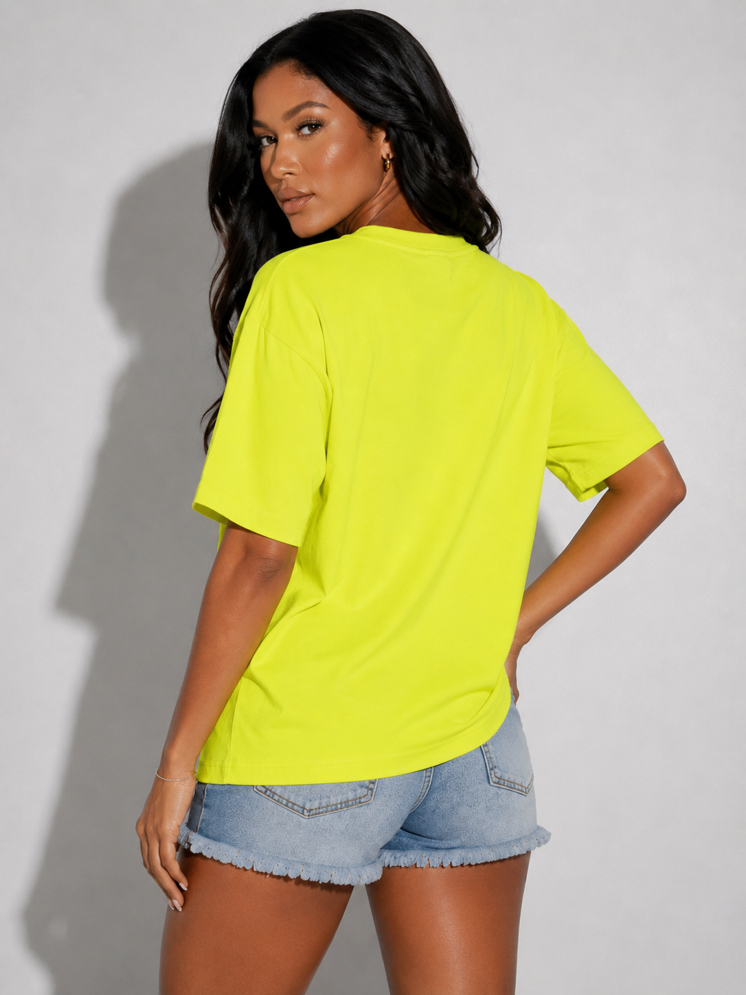 83064-lime multi Front view of model wearing an oversized yellow multi graphic face print T-shirt, For Her NYC