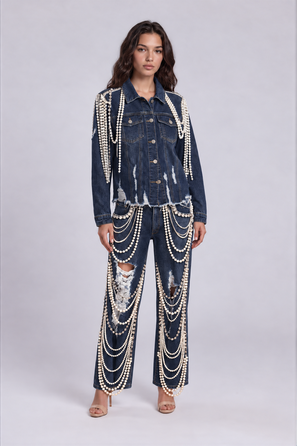 Front view of a model wearing the dark-wash For Her NYC Pearl Wide-Leg Denim Pants - 82776 with distressed details and cascading pearl embellishments