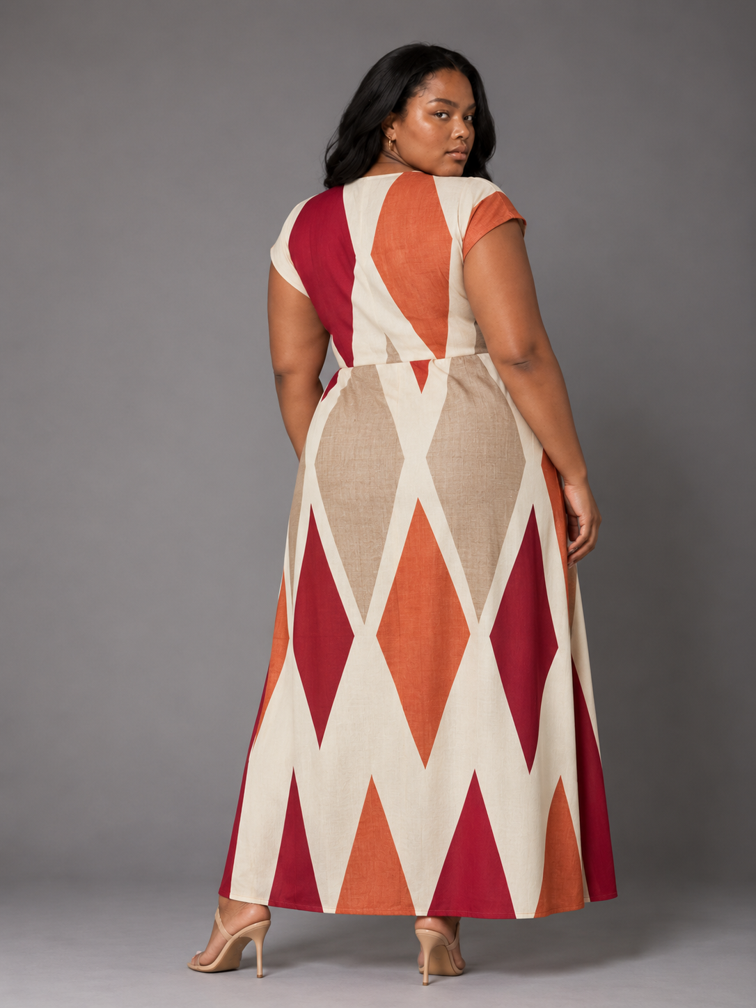 Back view of the For Her NYC Plus Size Bisa Print Pantset featuring a cream, orange, red and beige geometric print tunic with coordinating pants, style S0178.