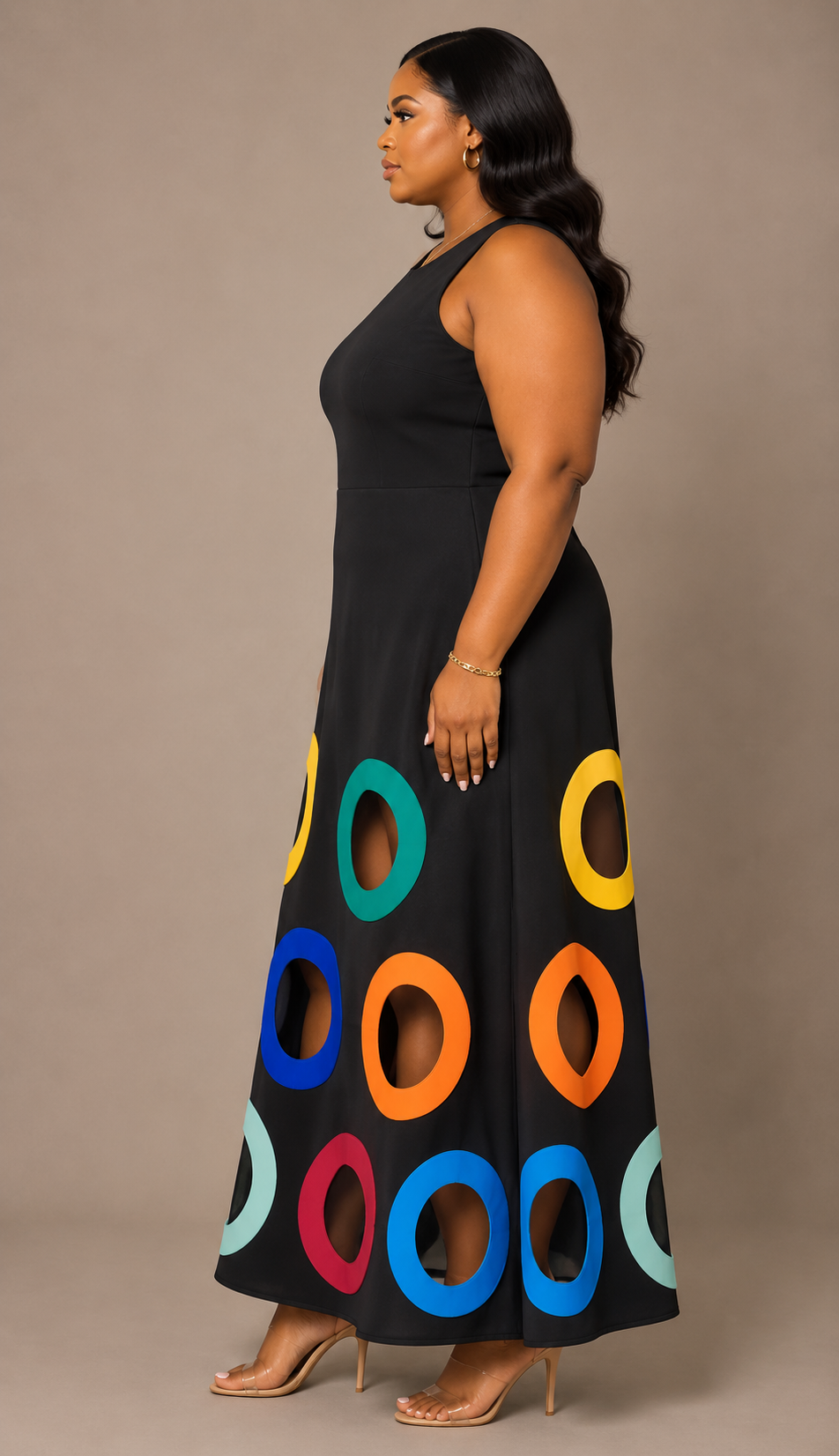 Side view of a plus size model wearing the For Her NYC Colorful Circles Cutout Dress in black with multicolor circle cutout details along the skirt, style S0176W