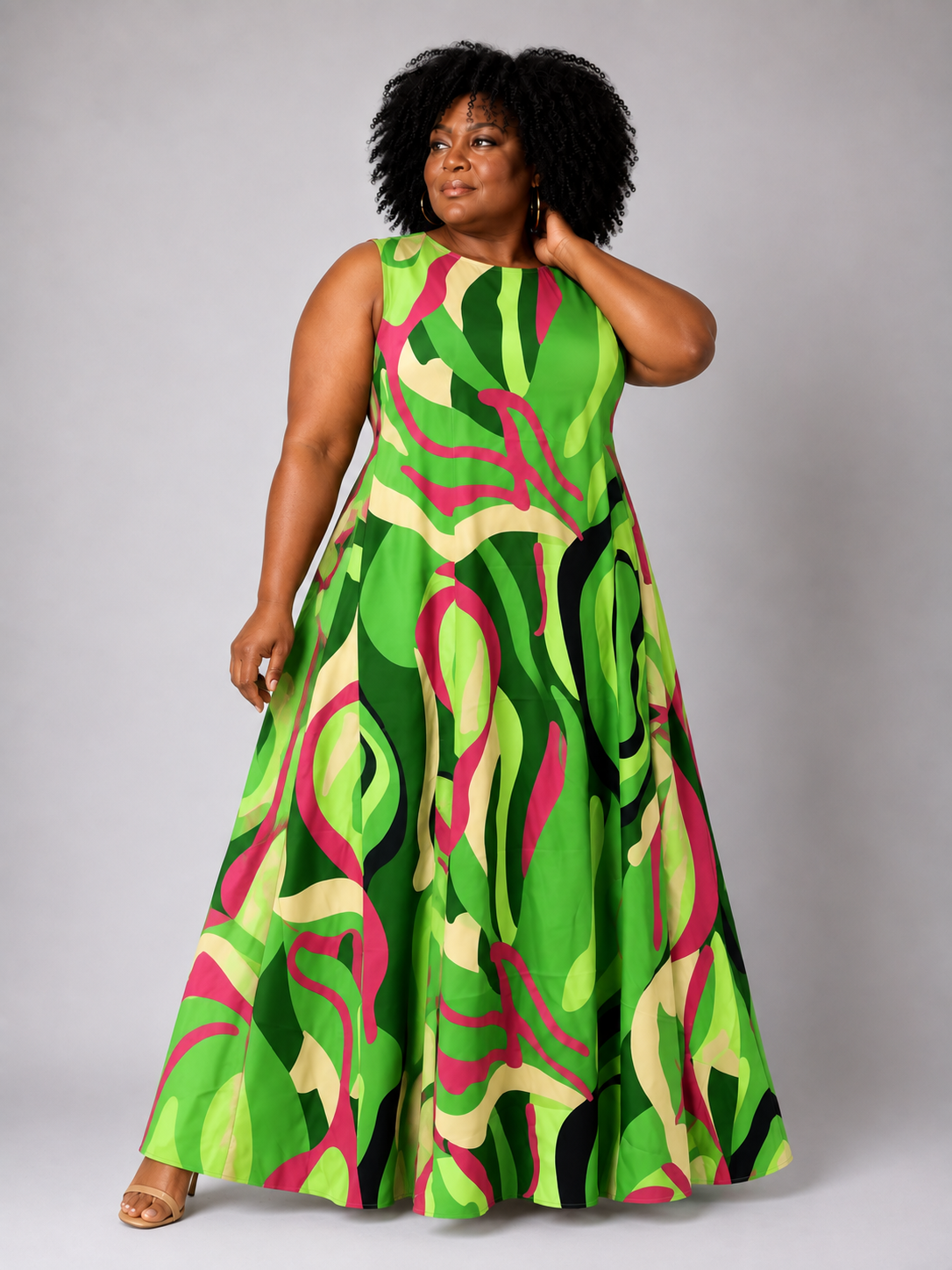 Front view of a model wearing the For Her NYC Plus Size Oversized Swirls Print Maxi Dress with a vibrant green multicolor abstract swirl print, style S0177W.