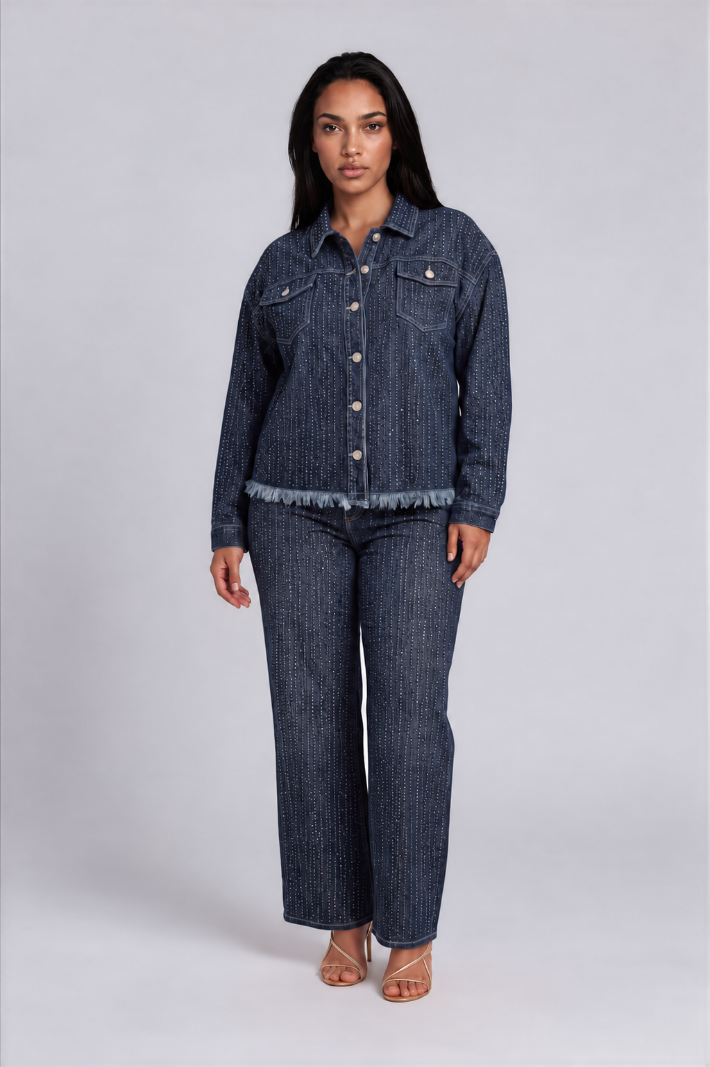 Front view of a model wearing the For Her NYC Rhinestone Embellished Denim Jacket - 82978 with dense rhinestone rows and a frayed hem