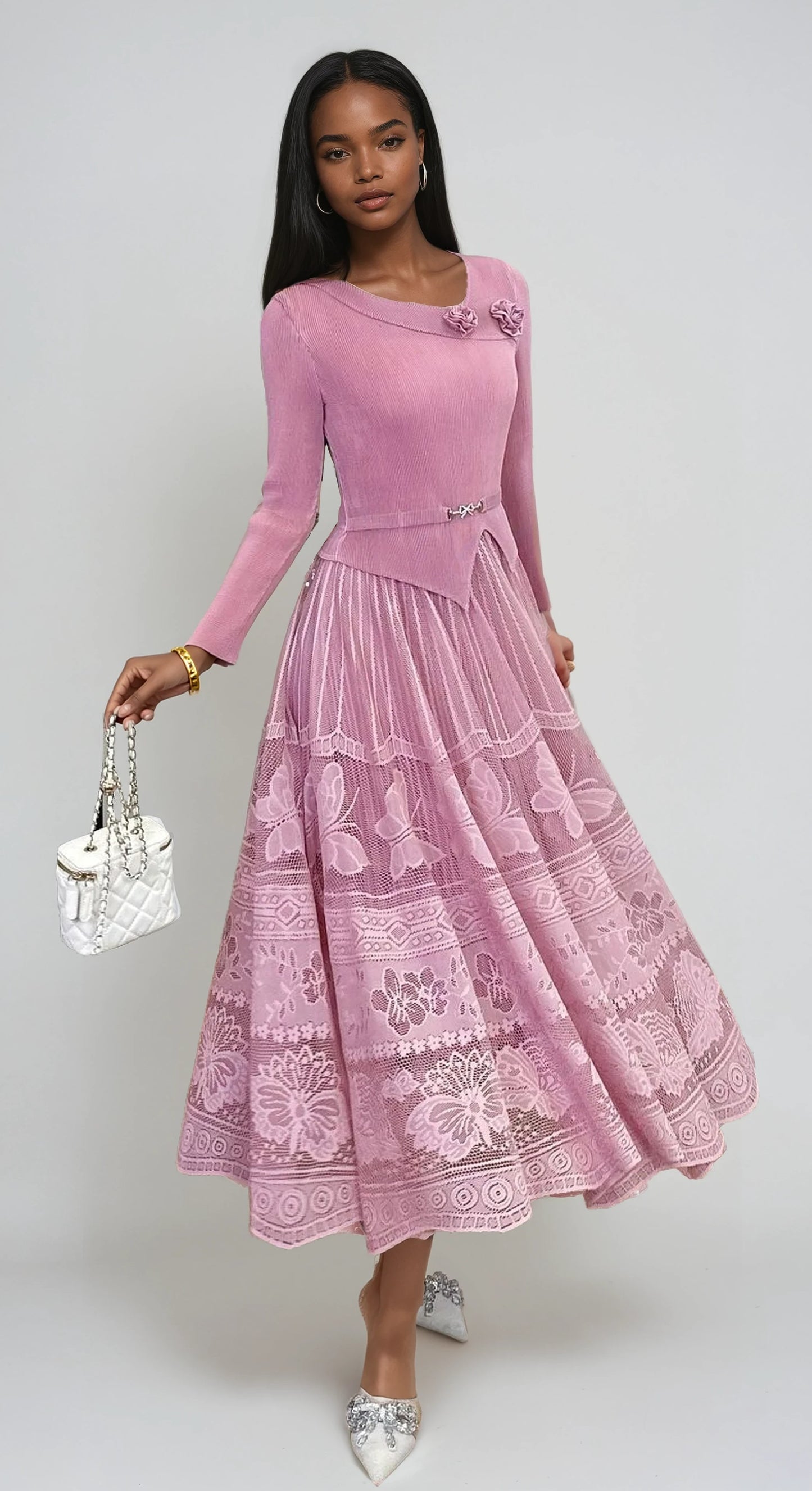 Model wearing dusty pink pleated lace midi dress with floral lace detail and elegant full skirt by For Her NYC.