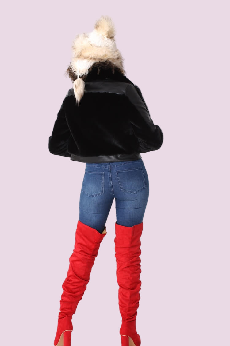 Black faux fur jacket with studded lapel shown from the back, showcasing the clean back silhouette, plush faux fur texture, and cropped length by For Her NYC