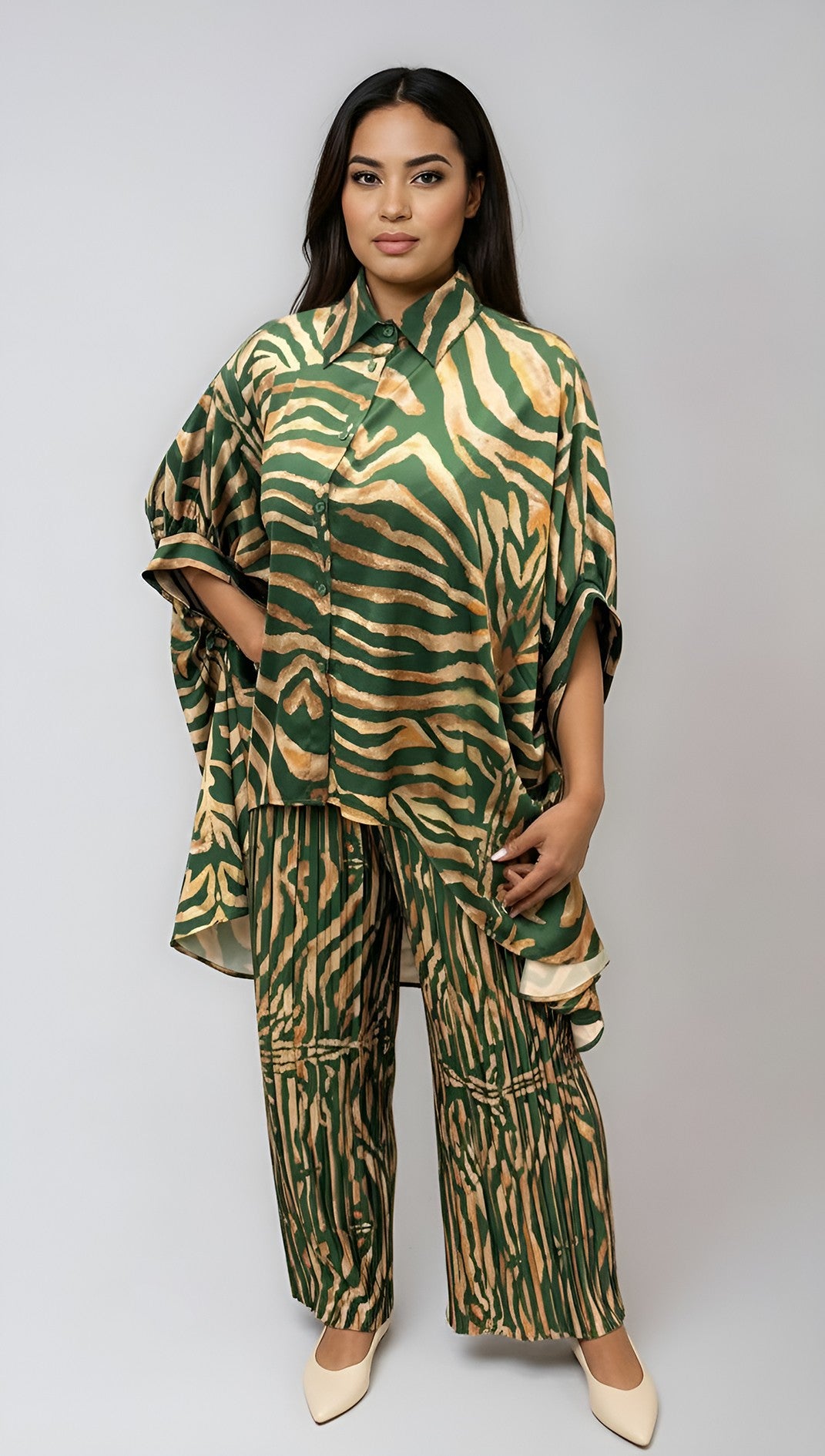 Model wearing green zebra printed lounge 2-piece pant set with relaxed top and wide leg pants.