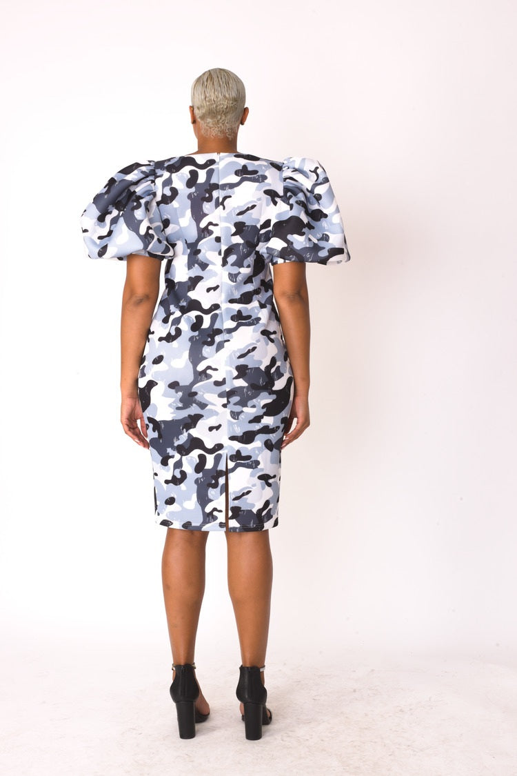 Back view of grey camouflage scuba midi dress showing modern chic silhouette.