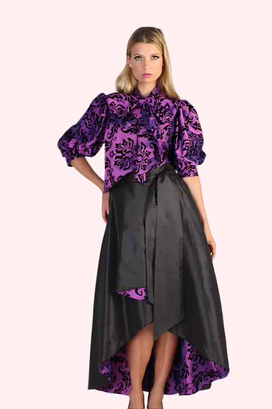 High-low black baroque skirt with dramatic flared silhouette, front pose.