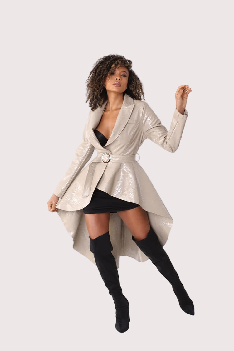 Beige high-low crocodile coat shown in motion with belted waist – For Her NYC