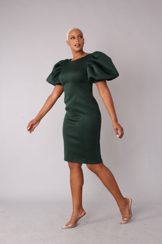 Model wearing hunter green scuba puff sleeve midi dress with a figure flattering silhouette.