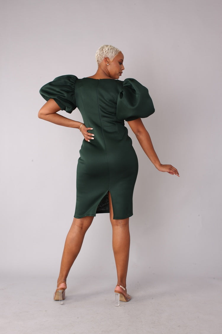 Hunter green scuba midi dress angled view showing puff sleeve detail and sleek fit.