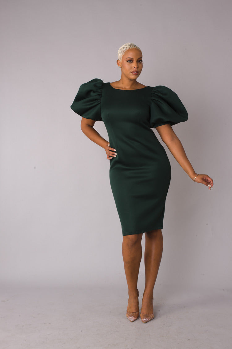 Hunter green scuba midi dress with dramatic puff sleeves and classic elegant fit.