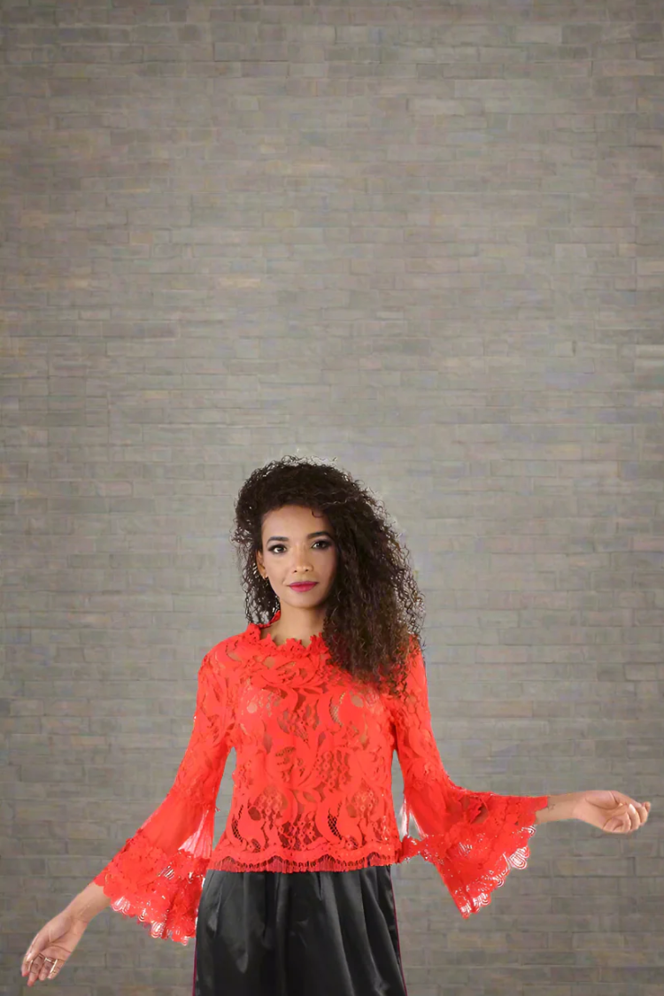 Front view of lace bell sleeve top in red with layered sleeves and ruffled neckline — For Her NYC.
