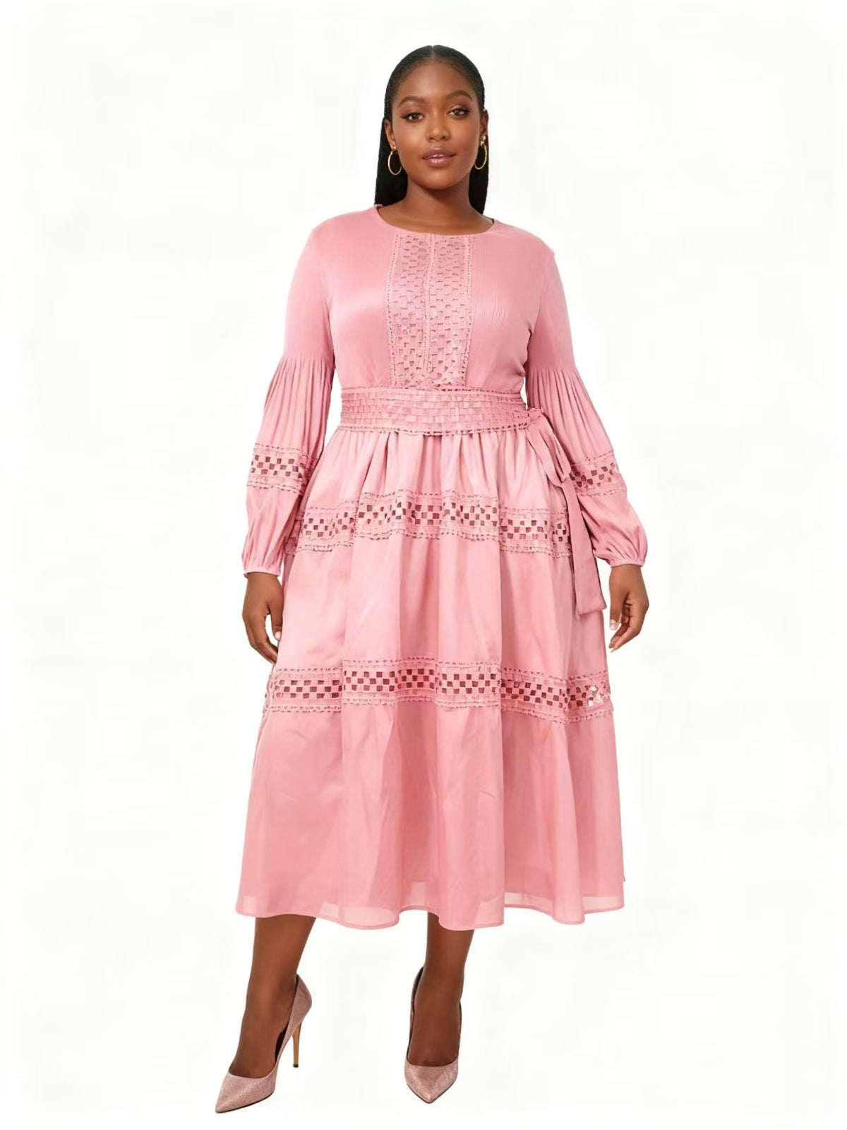 Front view of model wearing a pink long sleeve tiered midi dress with soft pleating and lace detailing, For Her NYC