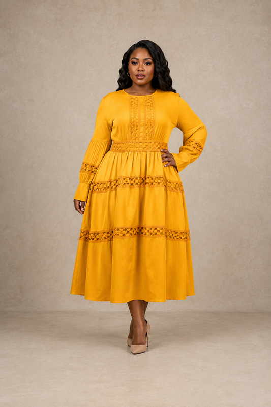 Front view of model wearing a yellow long sleeve tiered midi dress with lace inset panels and defined waist, For Her NYC