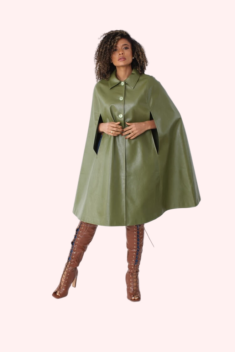 Angled pose of army green faux leather cape coat showing front drape and wide sleeves – For Her NYC