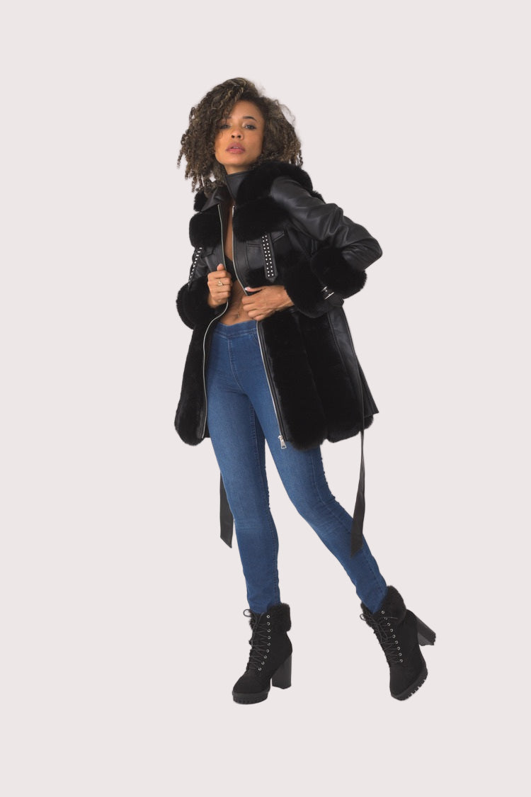 Black faux leather jacket side angle walking pose
