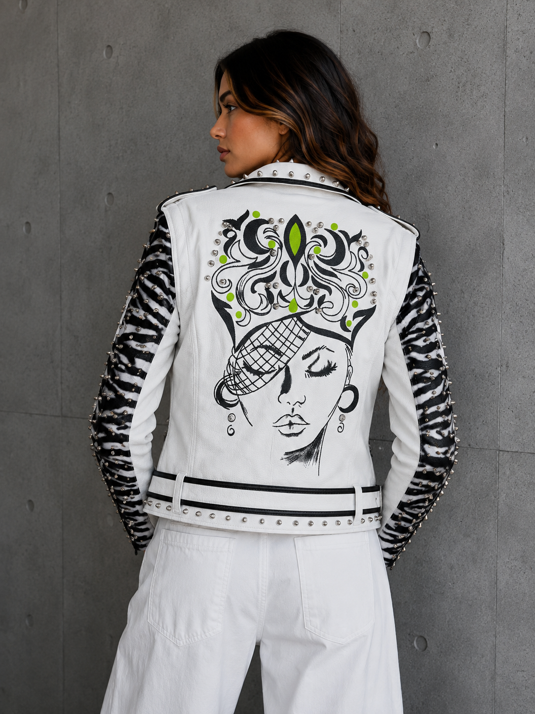 Faux leather jacket back view showing bold graphic print and sleeve detail.